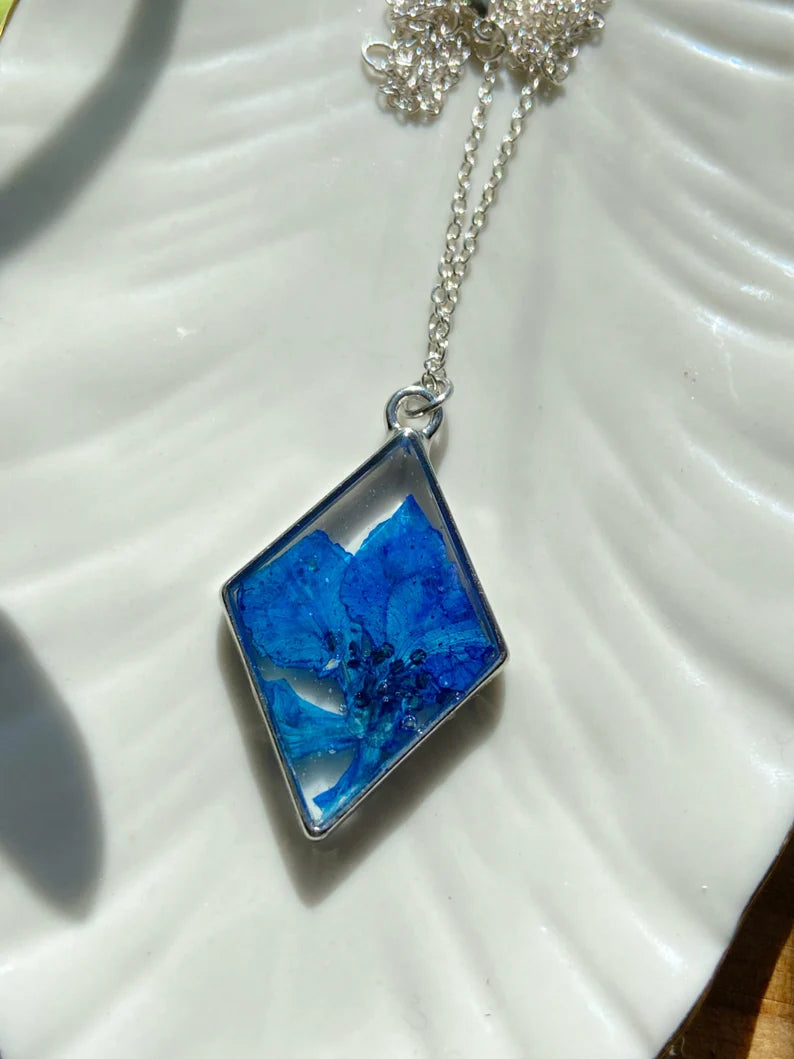 Larkspur- Blue pressed flowers in silver open diamond-shaped pendant, preserved botanical jewelry
