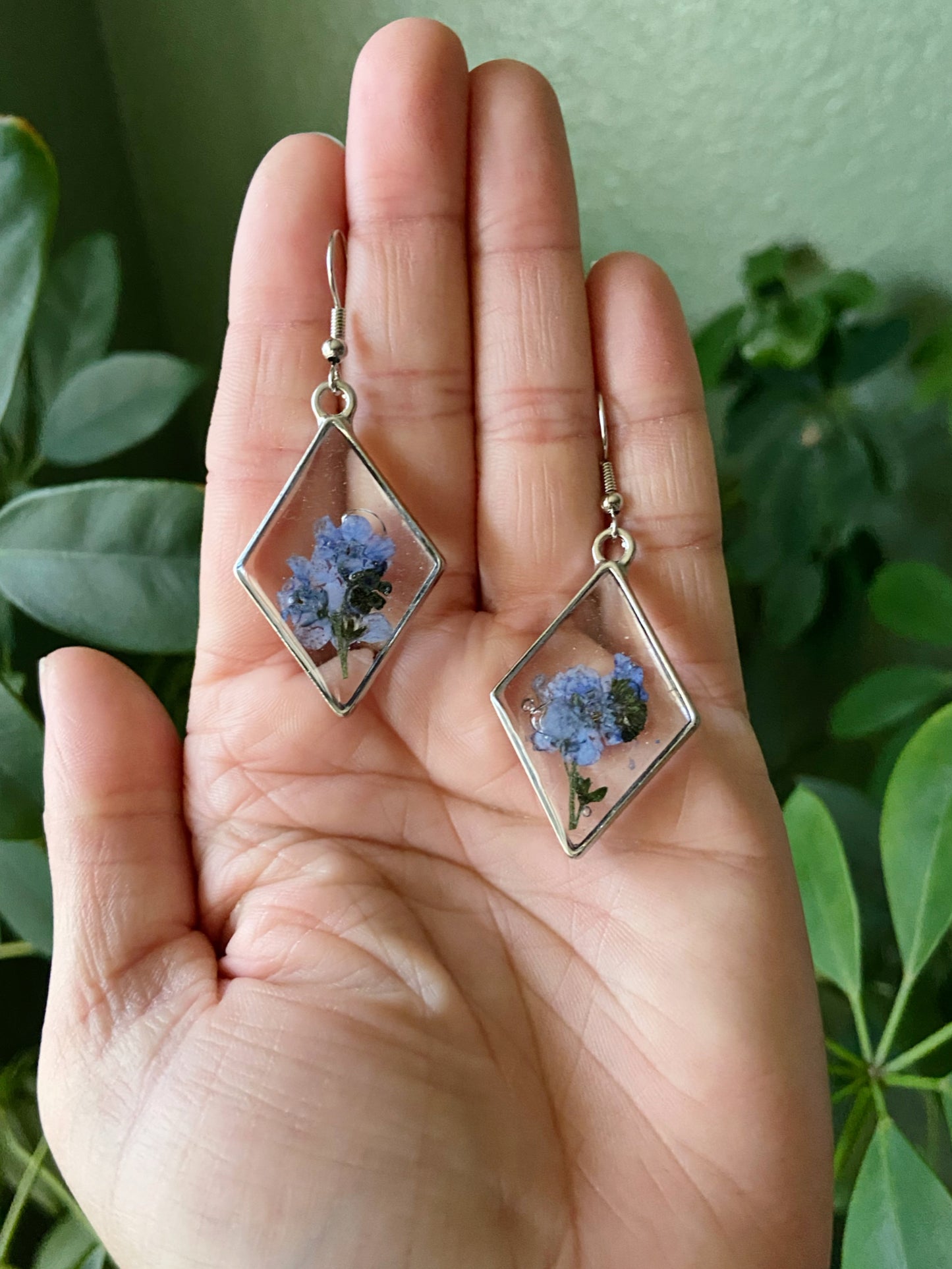 Forget Me Nots- Real blue flower clusters inside open silver diamond-shaped earrings