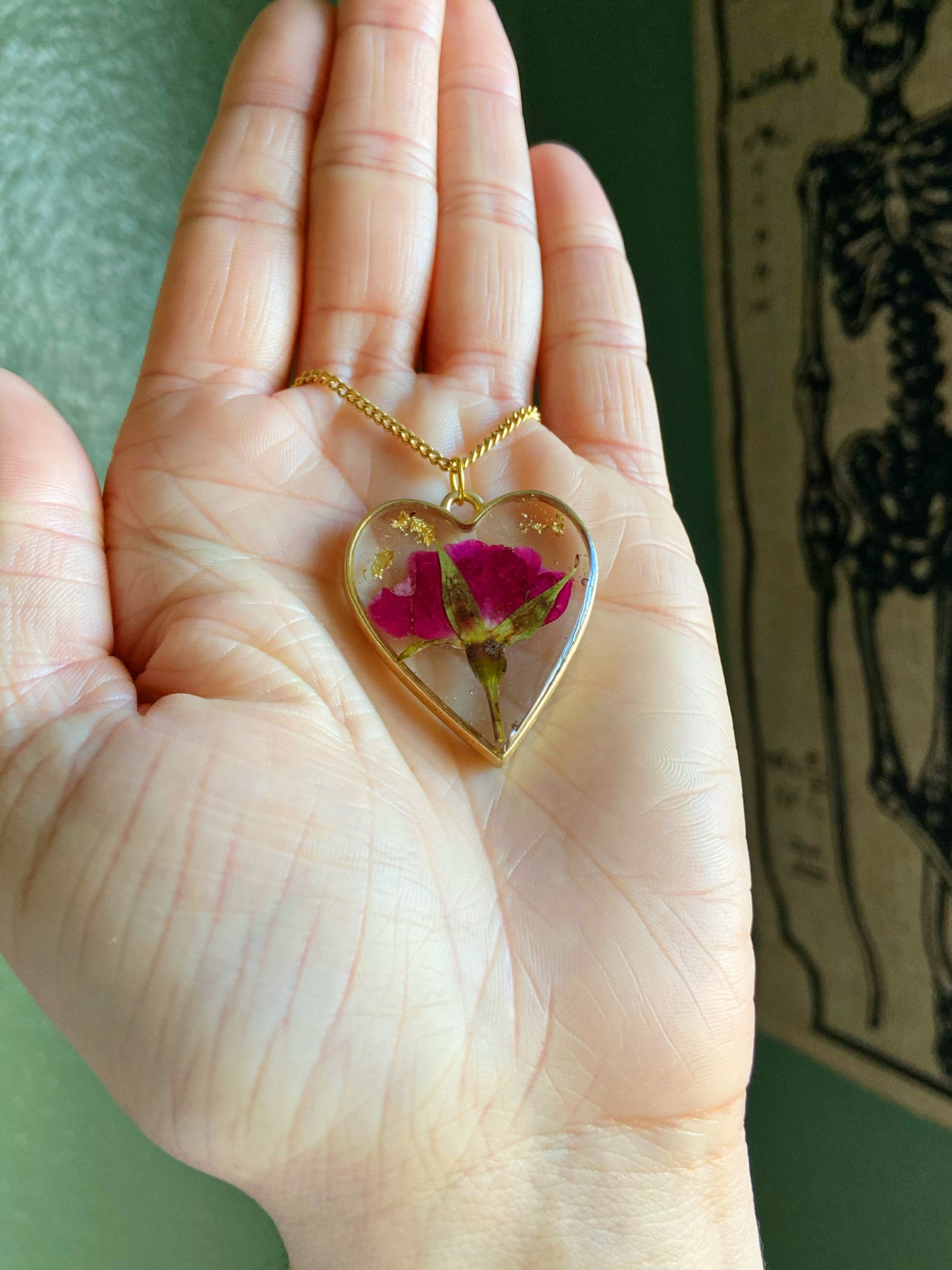 Roses- Red pressed rose buds & gold flake inside gold open heart-shaped matte pendant, 16" gold-plated chain included