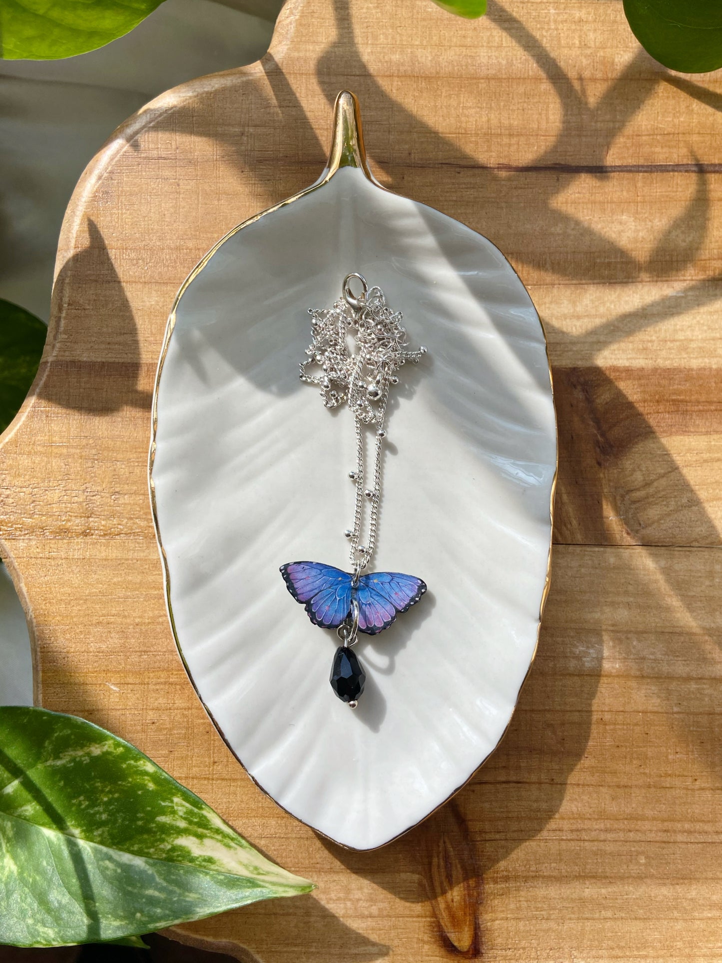 Mini Butterflies- Upcycled paper blue & purple morpho butterfly pendant with black glass bead dangle, 17" sterling silver plated chain included