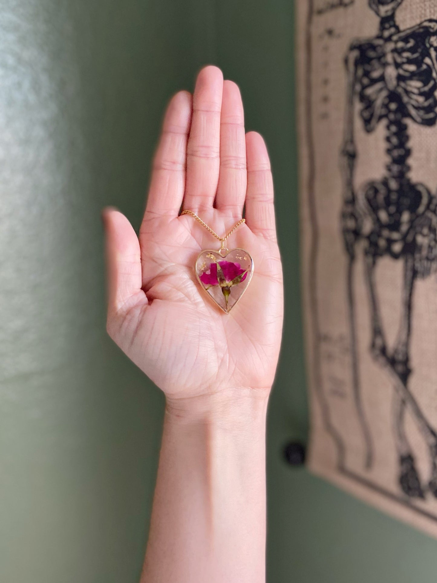 Roses- Red pressed rose buds & gold flake inside gold open heart-shaped matte pendant, 16" gold-plated chain included