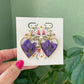 Larkspur- Purple pressed flowers and gold flake inside open gold heart earrings, preserved botanical jewelry