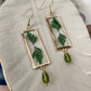 Greenery- Real pressed leaves symetrically preserved inside long open gold rectangular earrings, olive green glass drop bead