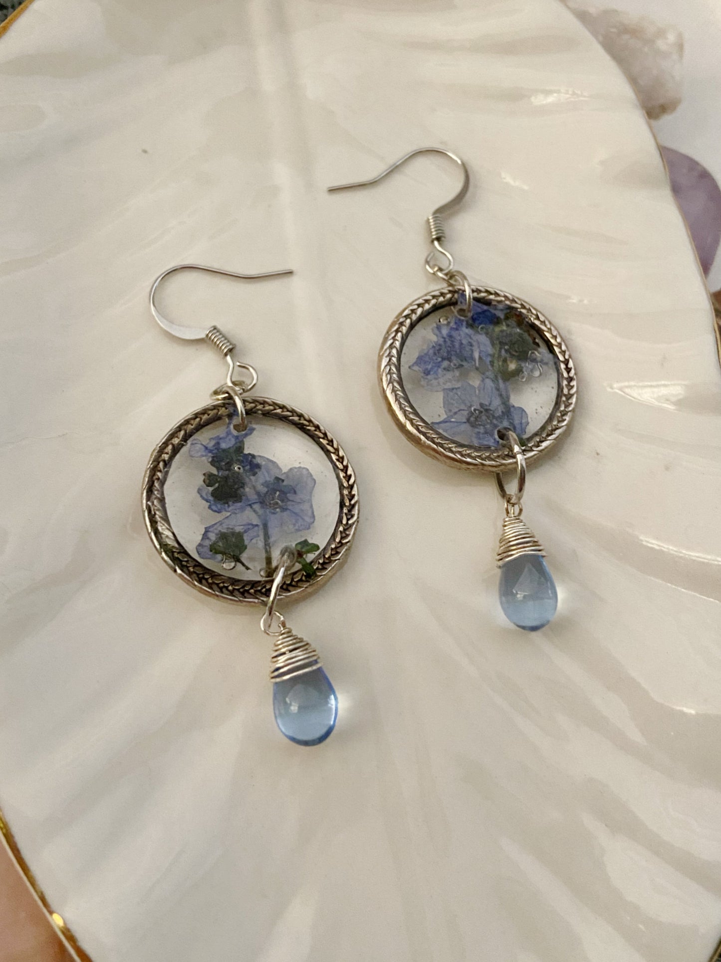 Forget Me Nots- Real blue flower clusters inside open silver leaf-patterned circle earrings with blue glass drop beads